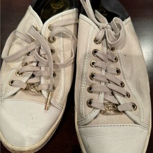 Micheal Kors size 10 tennis shoes with gold accents